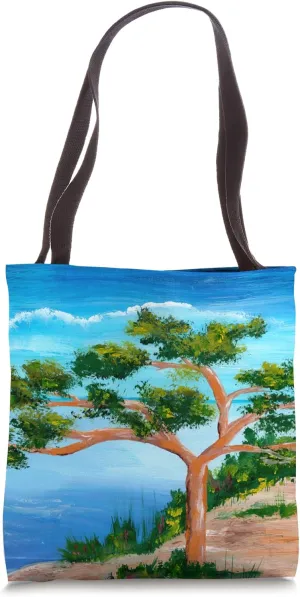 Solitary pine tree at the beach in coastal landscape Tote Bag